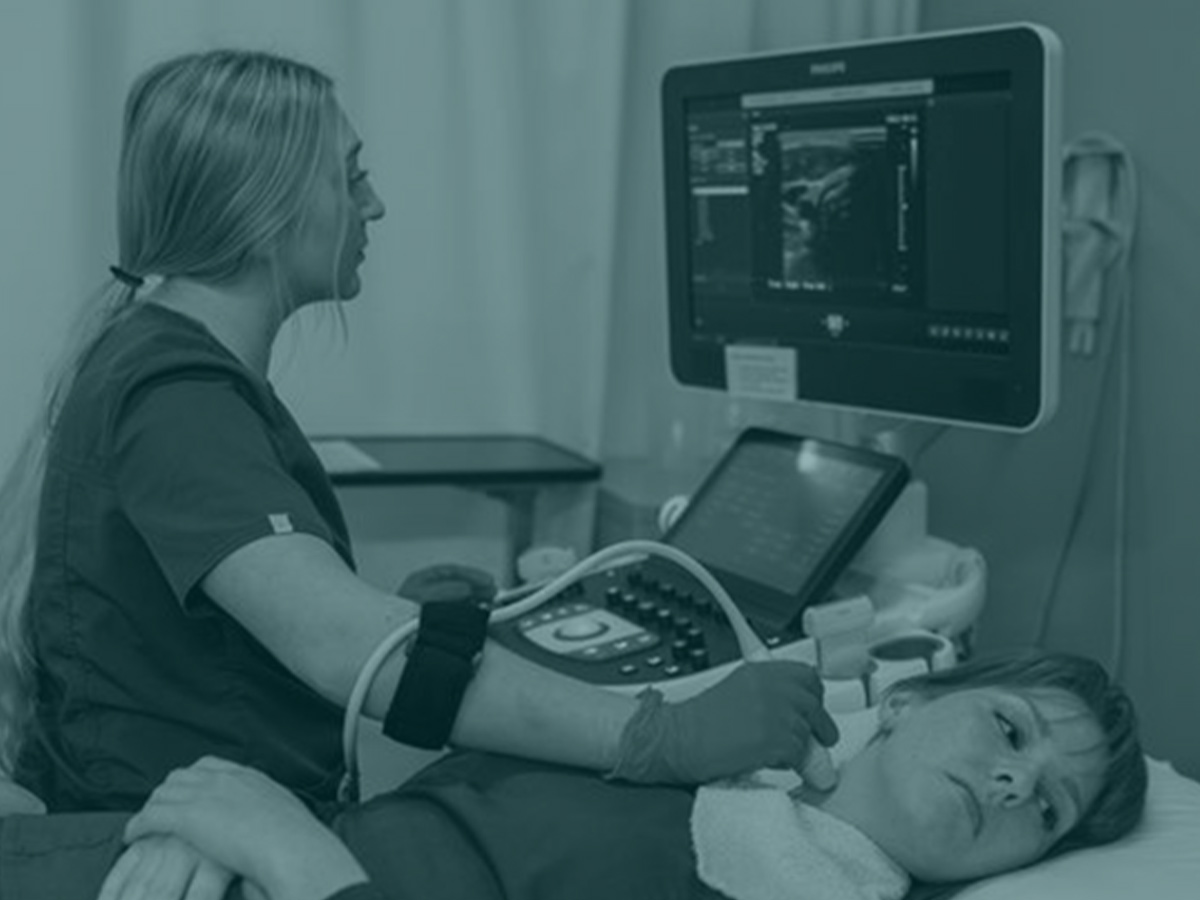Sonographer looking at monitor