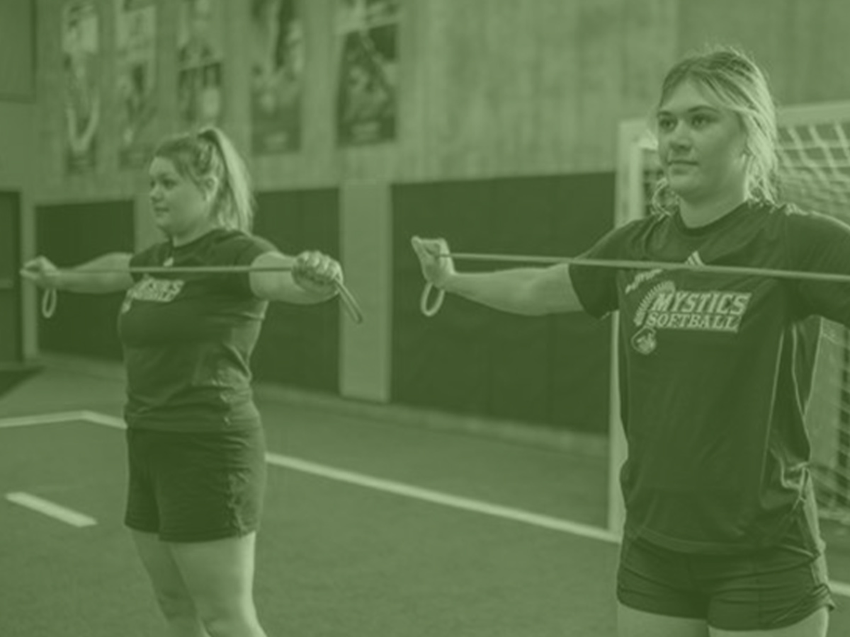 Girls doing exercise with bands