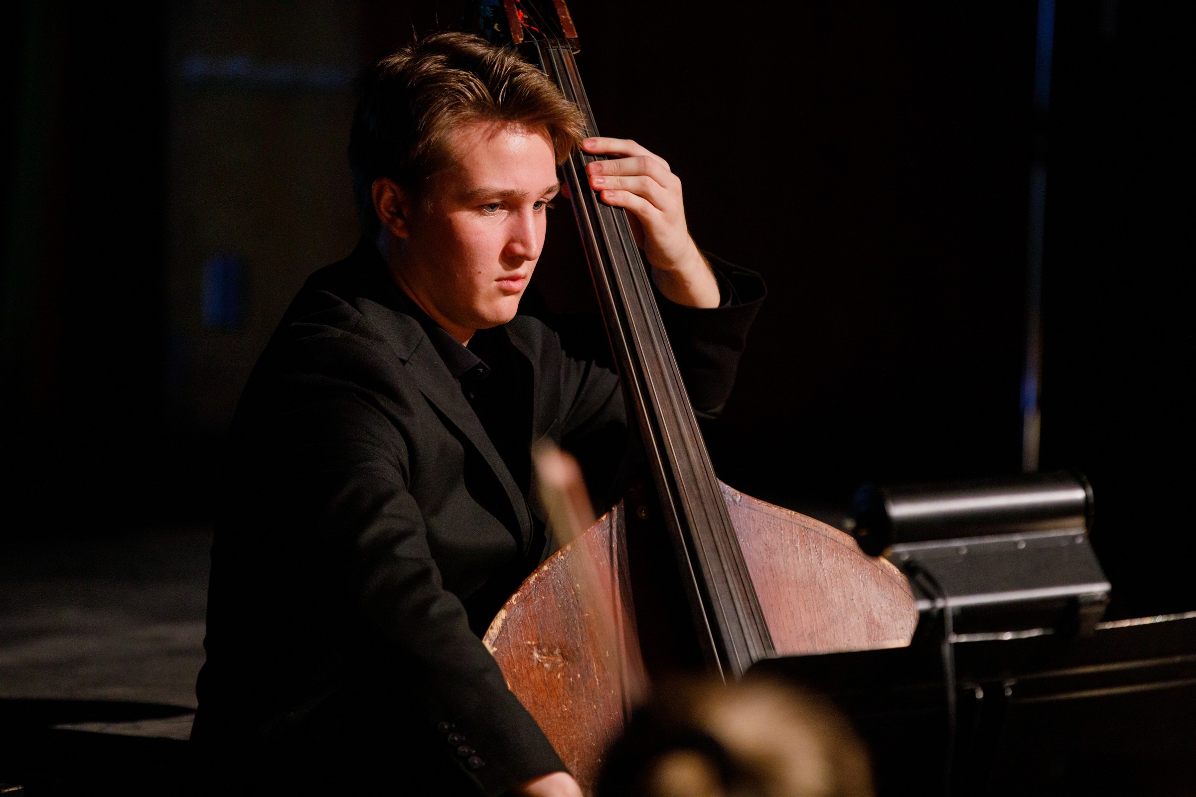 Male playing string instrument