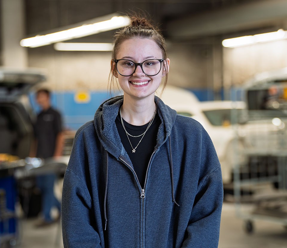 Student in car shop